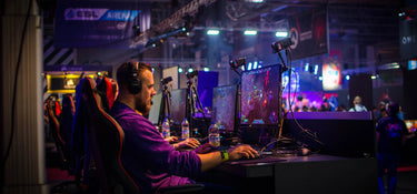 Gamers at ESL Arena focused on intense esports competition.