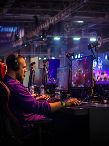 Gamers at ESL Arena focused on intense esports competition. mobile