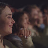 girl lugging in cinema 